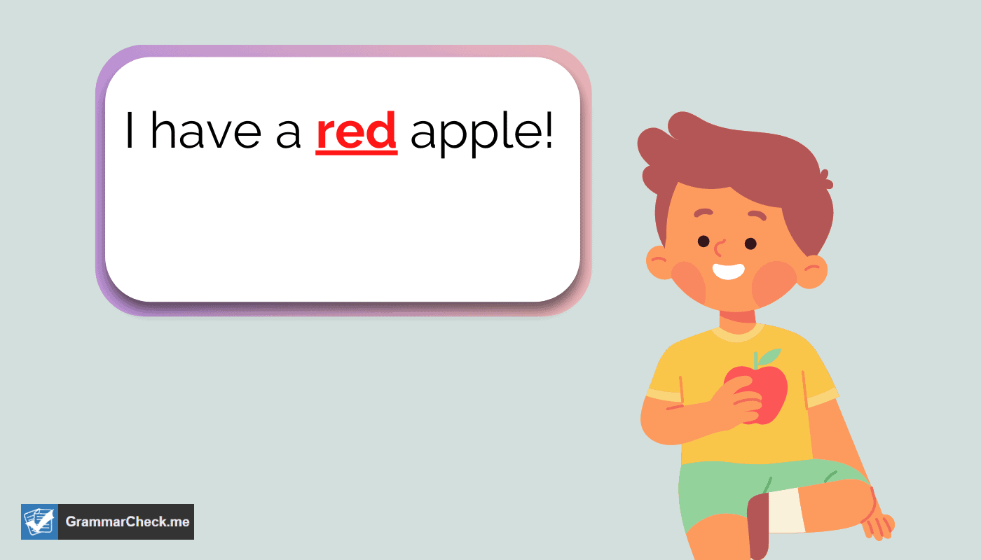 a picture of a boy holding up a red apple in his hand
