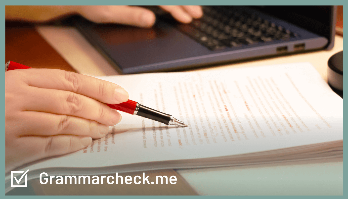 image of writer proofreading their work with a red pen